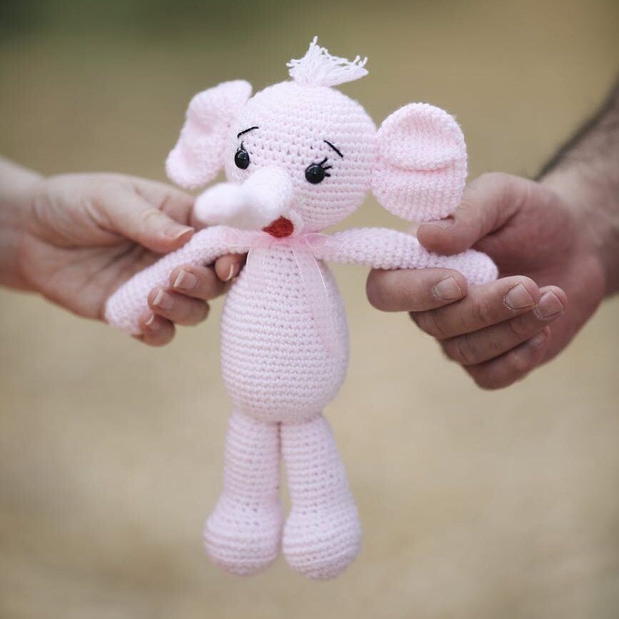 close up on man and woman holding toy